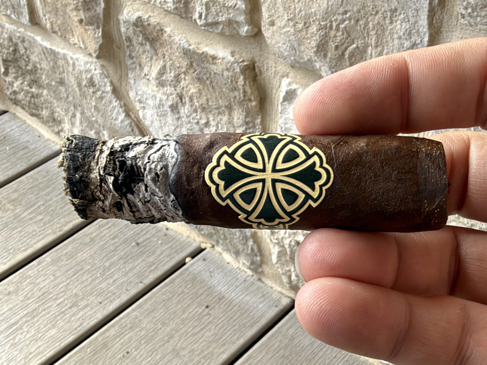 Dunbarton Sin Compromiso Seleccion No. 7 deep in the final third with the black and gold band still on and a dark, uneven ash at the foot