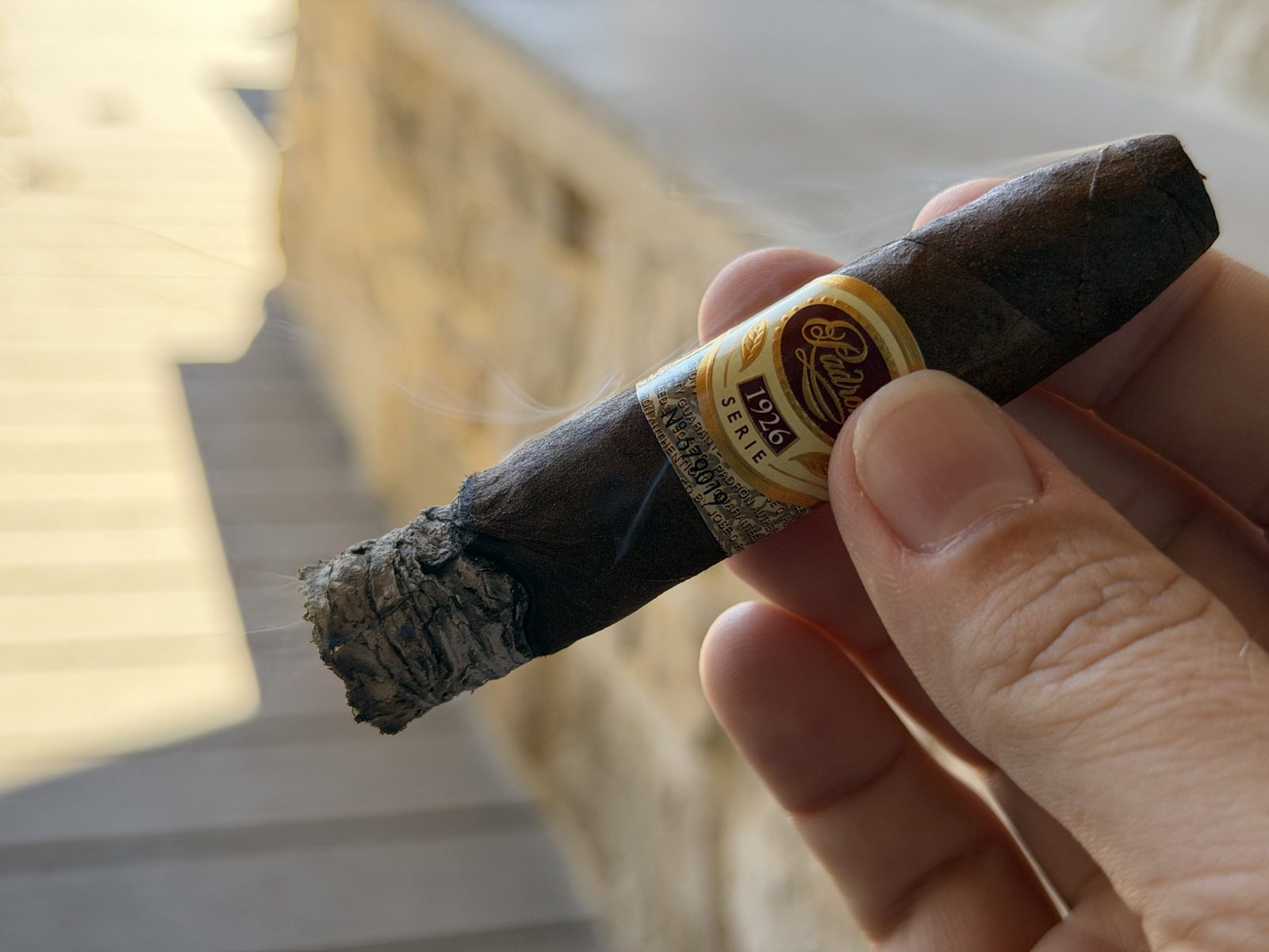 Padrón 1926 Serie 80 Years Maduro at the start of the final third with a tight but flaky ash throwing flyers