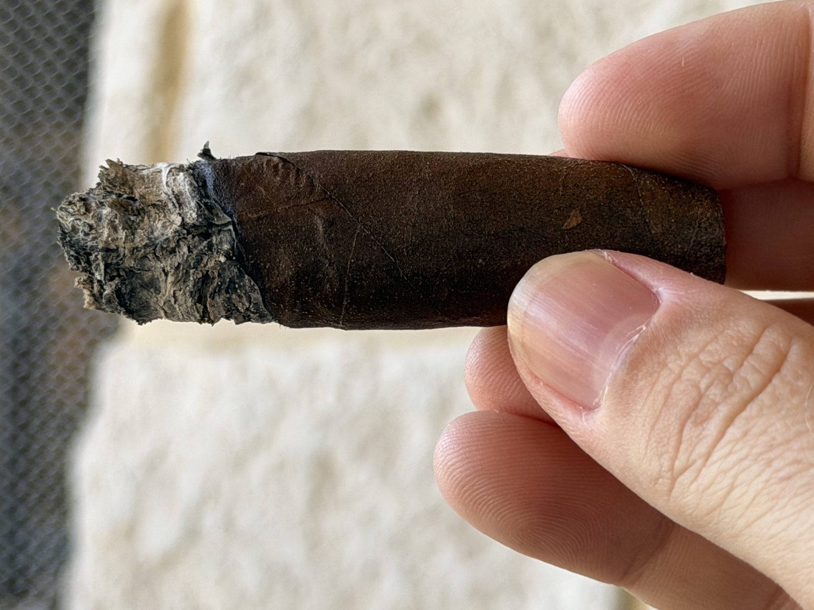 Padrón 1926 Serie 80 Years Maduro deep in the final third with a ragged, crooked ash before tapping it off