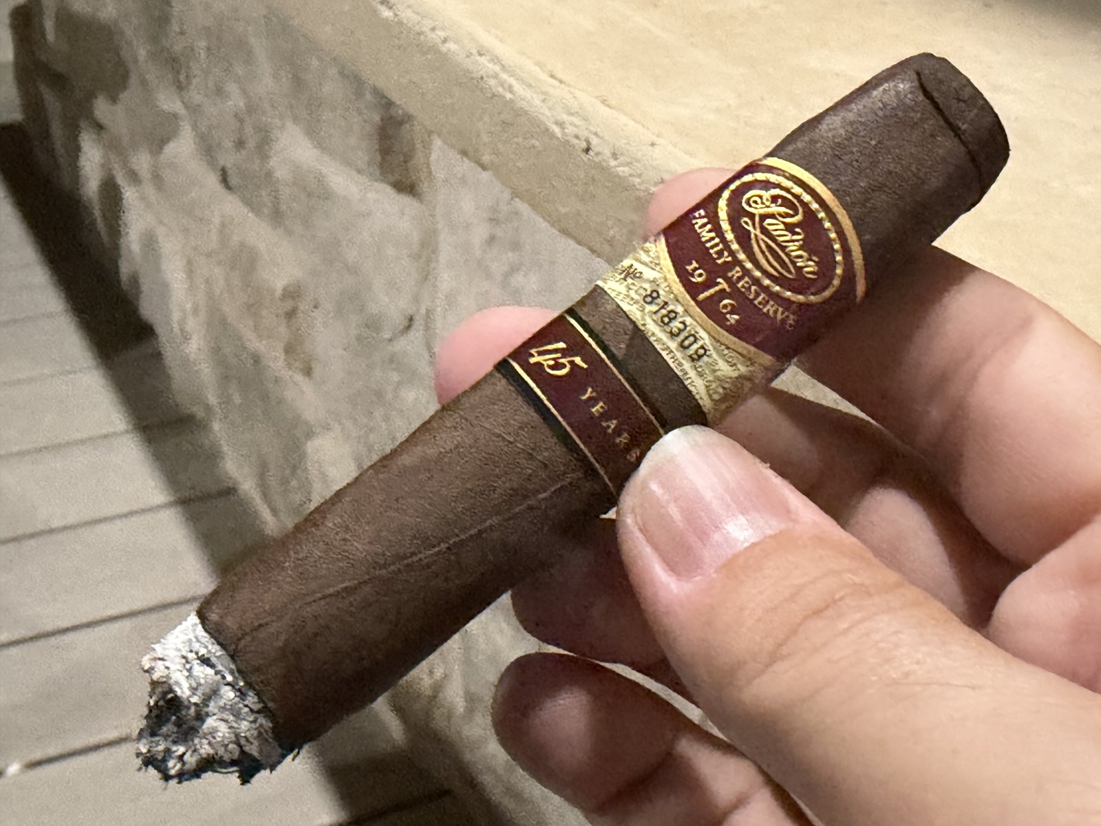 Padrón Family Reserve No. 45 Maduro in the first third with a short tight grey ash and a clean burn line